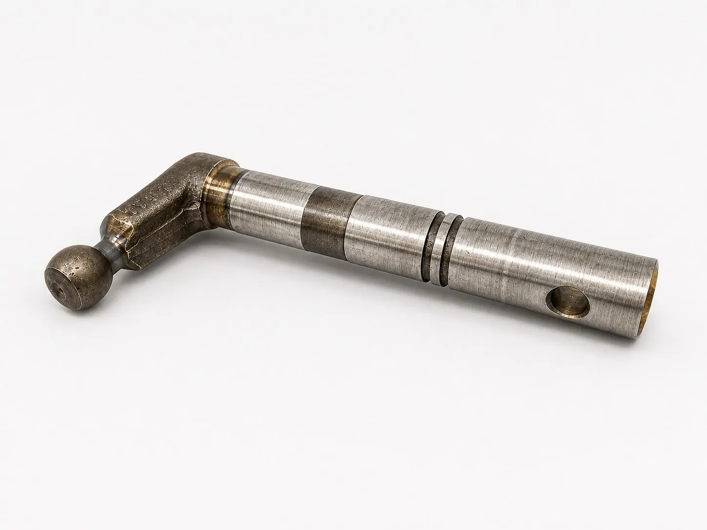 Long metal component with articulation, fits, and machined finish.